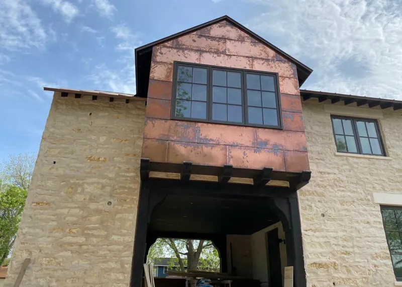 Copper metal panel facade on a stone building for Skylight Installation in Granite Bay